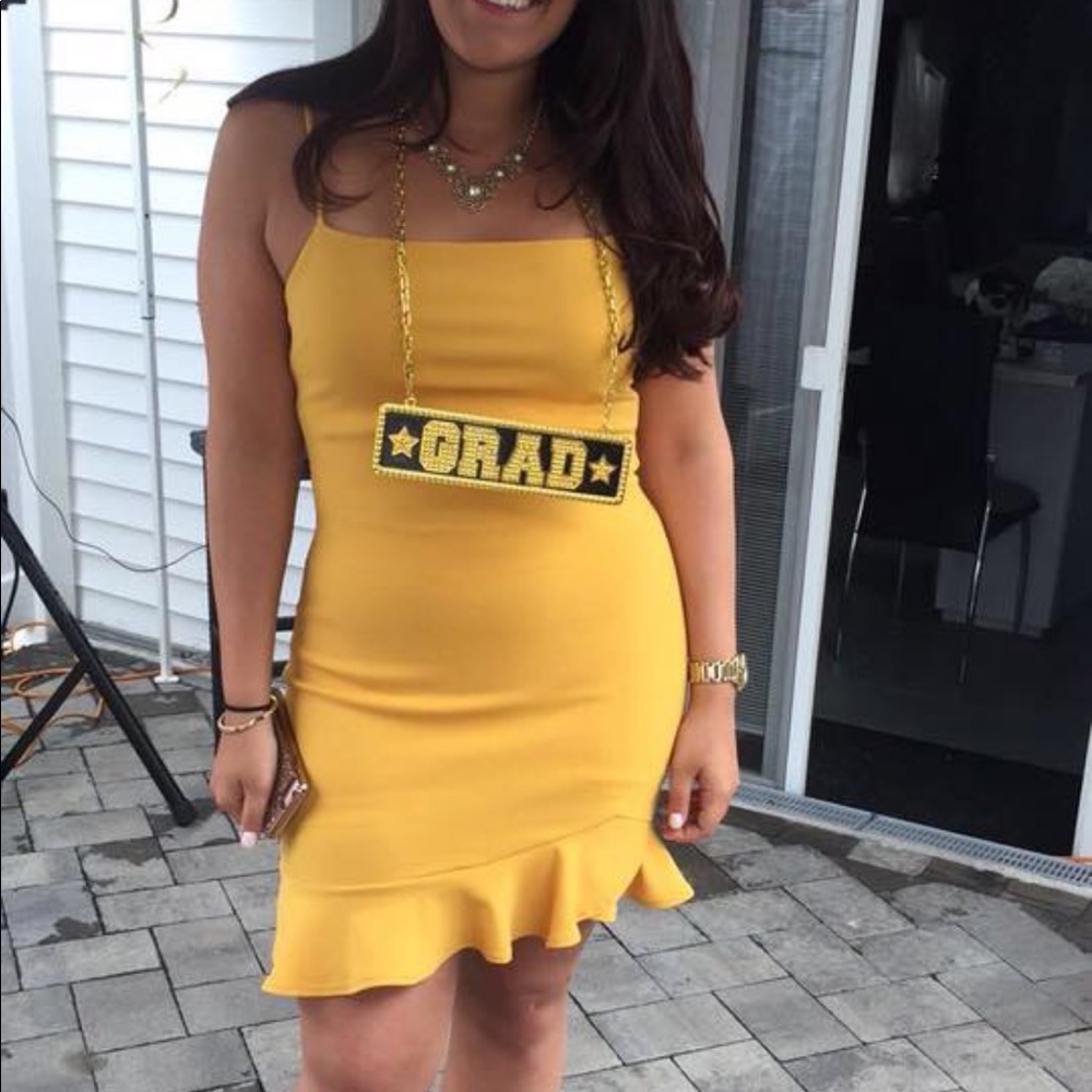 Gold mini dress. Ruffle bottom.